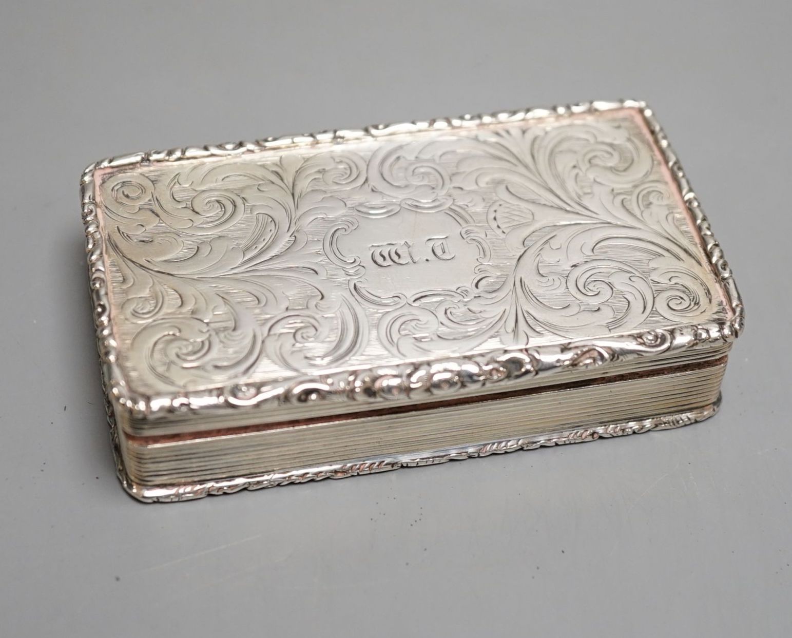 An early Victorian silver rectangular snuff box, with interior presentation inscription, Francis Clark, Birmingham, 1842, 82mm.